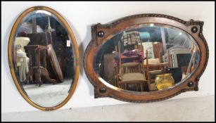 A good 1920's Jacobean revival oak wall mirror with gadrooned borders and embellished details
