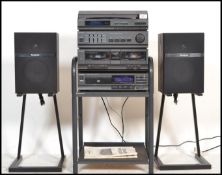 A 20th Century Panasonic stereo music system on stand, consisting of record deck, amplifier, radio