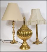 A collection of 3 20th century / contemporary brass table lamps to include a large bulbous