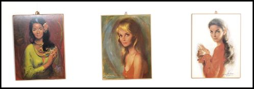 A group of three vintage retro 20th century Louis Shabner prints of maidens being unframed with