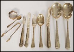 A group of silver hallmarked flatware daring from the 19th century to include a pair of London