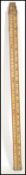 A vintage 20th century industrial metamorphic measuring stick slide rule having a telescoping
