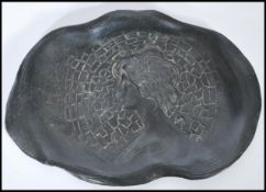 A 19th Century Art Nouveau cold cast metal pin dish, of shaped form with female bust to the centre