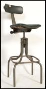 A vintage mid 20th century retro industrial machinist swivel chair by Leabank raised on yellow