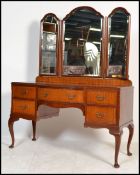 A vintage early 20th century 1930's Queen Anne revival mahogany dressing table raised on cabriole