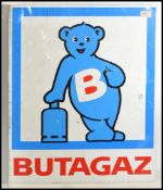 A vintage 20th century metal painted wall mounted industrial shop sign for Butagaz. White ground