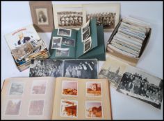 A collection of 20th century postcards being of topographical interest together with albums of black