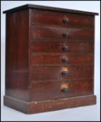 A Victorian mahogany specimin chest of drawers - table top cabinet being raised on a plinth base