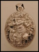 A large Indian silver white metal pendant locket featuring Kokopelli and Indian fertility God