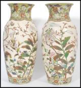 A pair of 19th Century Meiji period large Japanese Satsuma vases each of cylindrical bulbous form