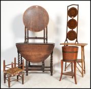 A collection of furniture to include a 1920's metamorphic cake stand, a tilt top circular oak table.