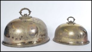 A pair of late 19th Century Victorian silver plated meat covers of domed form having foliate
