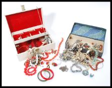 A collection of vintage 20th century costume jewellery to include a decorative yellow metal and