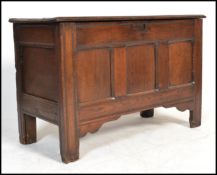An 18th Century country oak rectangular coffer chest with a plain hinged top and triple moulded