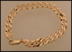 A hallmarked 9ct gold curb link bracelet chain having a lobster claw clasp. Weighs 10.3 grams.