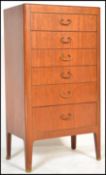 A vintage retro 20th Century teak wood tall upright chest of drawers, six graduating drawers with