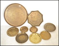 A group of Persian / Islamic copper and brass charger trays dating from the 19th century. The