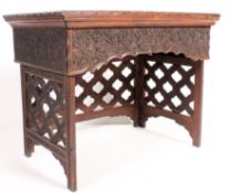 A 20th century Anglo Colonial hardwood campaign folding desk. Raised on a portcullis style panel