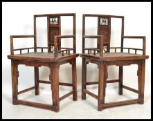 A pair of Chinese walnut Elbow Chairs ( armchairs ) with pierced and carved splats floral
