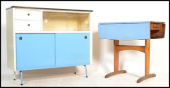 A vintage retro mid century formica topped drop leaf table with central drawer to one end.