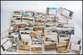 A collection of vintage postcards mostly mid 20th century examples to include topographical views