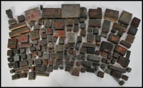 A collection of early 20th century advertising wooden backed copper and metal printing blocks, the