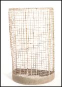 A vintage 20th Century Industrial / school playground / park tall upright / wall mesh bin,  half