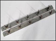 A pair of vintage 20th century steel butchers meat hooks. Each set having five hooks on