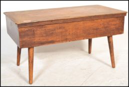 An early 20th century beech wood sewing box stool of rectangular form complete with the contents.
