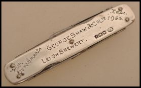 An early 20th century silver hallmarked penknife of advertising interest marked George Shaw & Co.