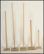 A collection of 6 vintage 20th century wooden shop / haberdashery hat stands. All of varying size