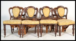 A run of eight 19th Century mid Victorian mahogany trefoil / balloon back dining chairs jhaving