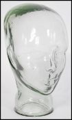 A vintage retro 20th century phrenology / milliners mannequin type head of pressed glass