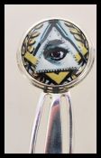 A stamped 925 silver book mark with an enamelled masonic image of an eye to the finial. Weight 5.