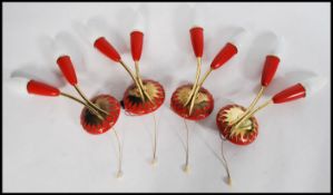 A set of four mid vintage retro 20th century 1960's wall lamps with twin red tulip glass sconces
