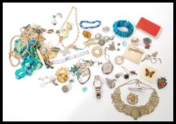A collection of vintage costume jewellery to include a good selection of brooches to include some