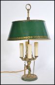 A Louis XVI Bouillotte four light candleabra coaching lamp on a round base with a green tole shade