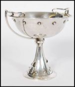 An early 20th century silver hallmarked trophy cup centerpiece by Mappin and Webb. Hallmarked for