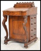 A Victorian walnut davenport, circa 1860, having remains of  fitted interior enclosed by writing