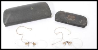 Two pairs of 19th century Victorian antique reading glasses, one in original leather case. Both