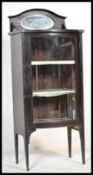 A 19th Century freestanding bow fronted ebonised pedestal  display cabinet, single bow fronted