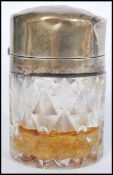 A 19th century Victorian silver hallmarked lidded cut glass storage pot having a faceted glass