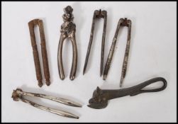 A group of antique nutcrackers and crustacean crackers to include 19th century Georgian examples,
