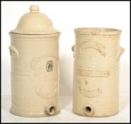 2 Victorian large ceramic water filters of cylindrical form to include a Howells Improved Water
