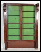 A 19th century Victorian mahogany chemists / shop Apothecary cabinet, fronted by two full length