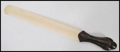 A 19th century silver hallmarked handled ivory bladed page turner having a long ivory panel with