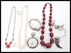 A group of vintage jewellery to include silver filigree butterfly bracelet, cherry bakelite bead