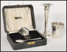 A group of silver items to include a silver hallmarked cased eggcup by Viner's Ltd (Emile Viner) and