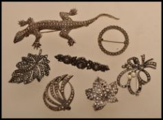 A selection of vintage 20th century silver white metal and marcasite brooches to include a brooch in