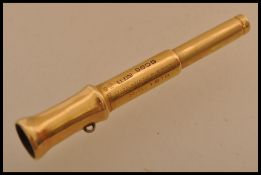A hallmarked 18ct gold propelling pencil in the form of a telescope by S Mordan and Co. Weighs 11.